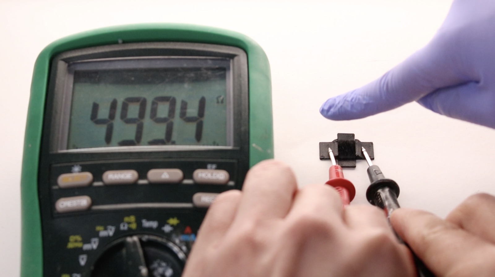 Carbon fiber flocked onto a flexible printed substrate